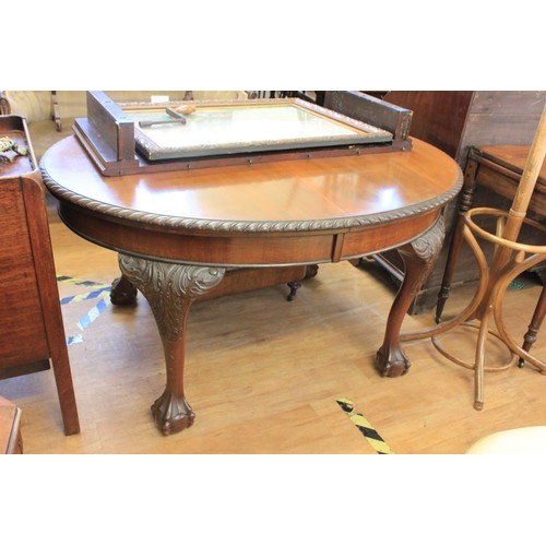 275 - An early 20th century mahogany oval wind-out dining table, 106cm x 178cm, extended.