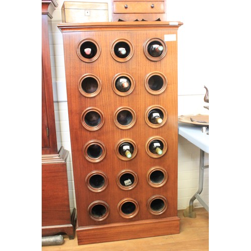 287 - A mahogany wine cabinet, fitted eighteen bottle recesses, on plinth base, 72cm wide x 138cm high.