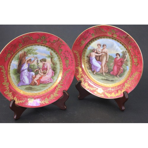 291 - A pair of German porcelain plates, the centres printed scenes after Angelica Kaufman, maroon and gil... 