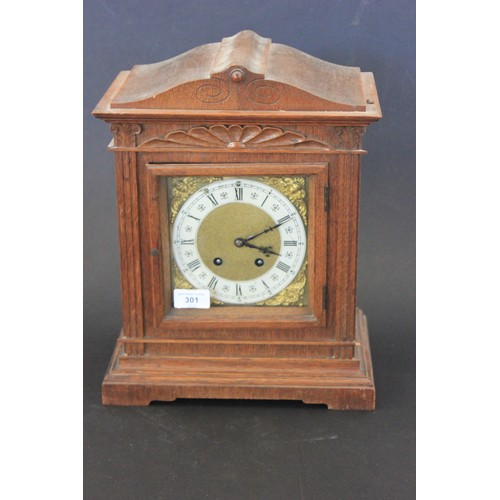 301 - An early 20th century oak mantel clock, in architectural case, 38cm high, a.f.