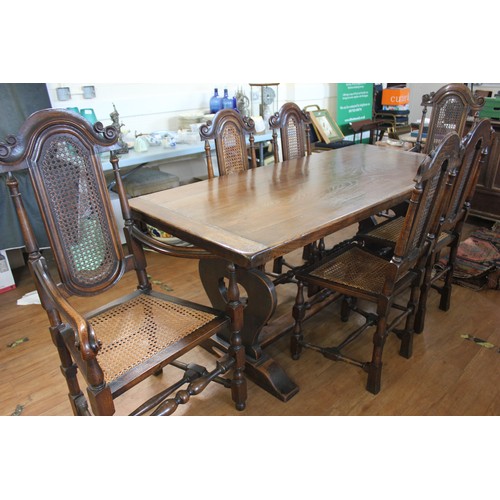 312 - A 20th century oak refectory style dining table with shaped end supports on trestle feet, 76cm x 176... 