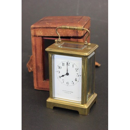 1 - A Gilt-brass carriage timepiece, 13cm high, with carrying case a.f.