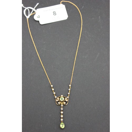 8 - A 9ct gold pendant, set a peridot, a pale blue topaz, and twenty seed pearls, on metal slender link ... 