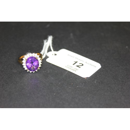 12 - A 9ct gold dress-ring, set large central amethyst and twenty tiny diamonds.