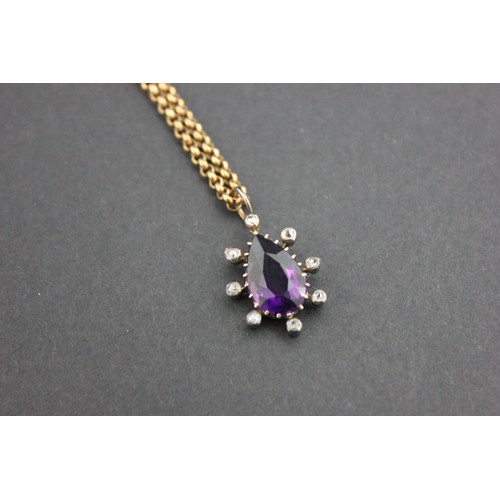 15 - An amethyst and diamond pendant, on 9ct gold slender link chain.