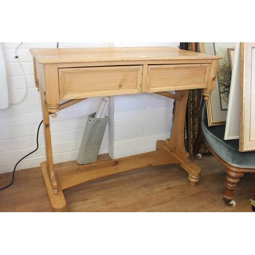 16 - A Victorian stripped pine writing table, fitted two drawers, 84cm wide.