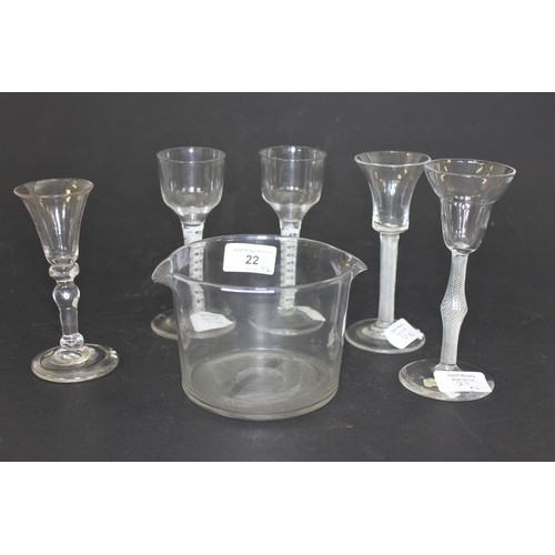 22 - A Georgian plain glass ice bowl, and five opaque twist and knopped stem coridal glasses, one with ch... 