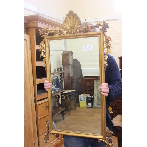 277 - A 19th century gilt framed wall mirror with shell crest, 60cm wide x 111cm high.