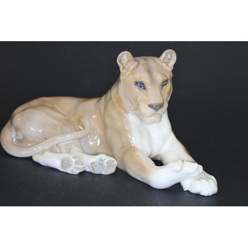 49 - A Royal Copenhagen figure of a recumbent lioness, 27cm long.