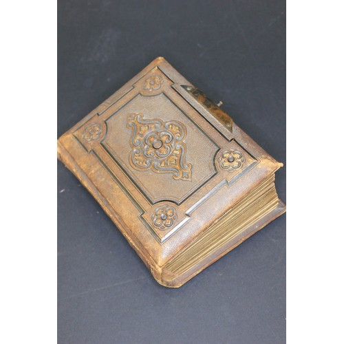 82 - A small Victorian photograph album containing some family photographs, together with images of India... 