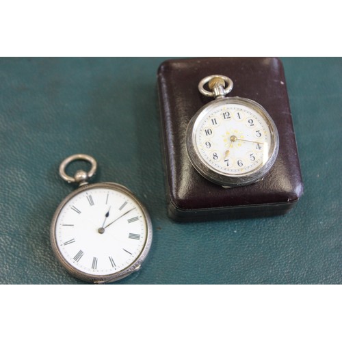 30 - A lady's fob watch in white metal case, with decorative enamelled dial, and another watch with white... 