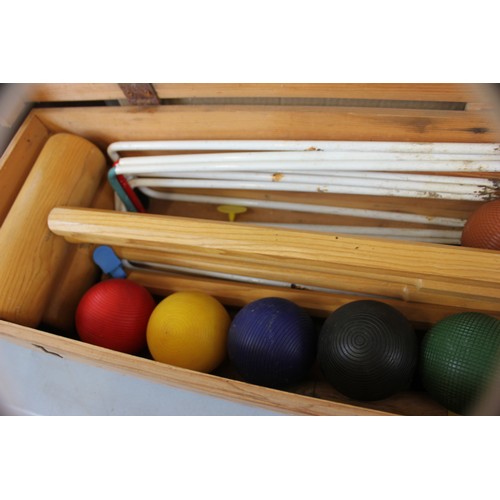 34 - A 'Jacques' croquet set in stripped pine box, including hoops, four mallets, balls, and other access... 