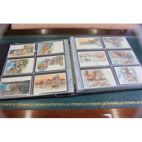 39 - An album of postcards including currency and flags, Imperial German military subjects, German towns ... 