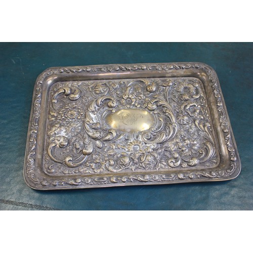 78 - An Edward VII silver tray with relief flower head and foliate scroll decoration, 30cm wide, Birmingh... 