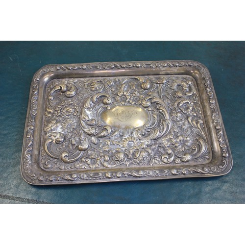 78 - An Edward VII silver tray with relief flower head and foliate scroll decoration, 30cm wide, Birmingh... 