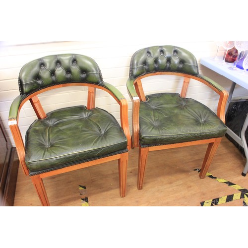 93 - A pair of pale stained beech elbow chairs with buttoned upholstery on square tapering legs (2).