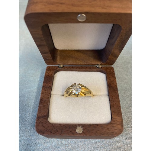 1 - An 18ct gold gent's signet ring, set a single diamond, approx. .92 carats, and approx. 6g, size Q.