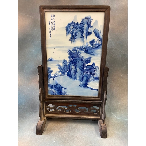 326 - A Chinese blue and white porcelain table screen, painted with a mountainous and river landscape and ... 