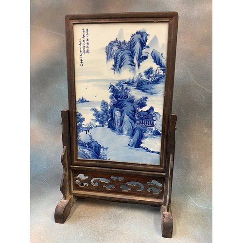 326 - A Chinese blue and white porcelain table screen, painted with a mountainous and river landscape and ... 