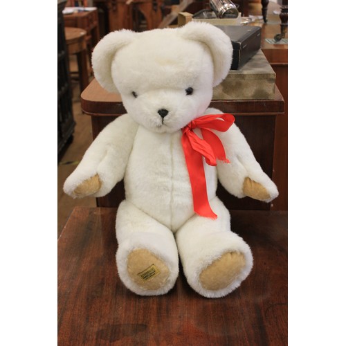 2 - A Merrythought polar bear with red ribbon, 63cm high.