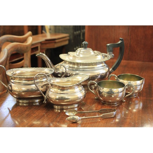 6 - A three-piece silver-plated tea set, a pair of silver-plated sugar nips, a further sugar bowl and cr... 