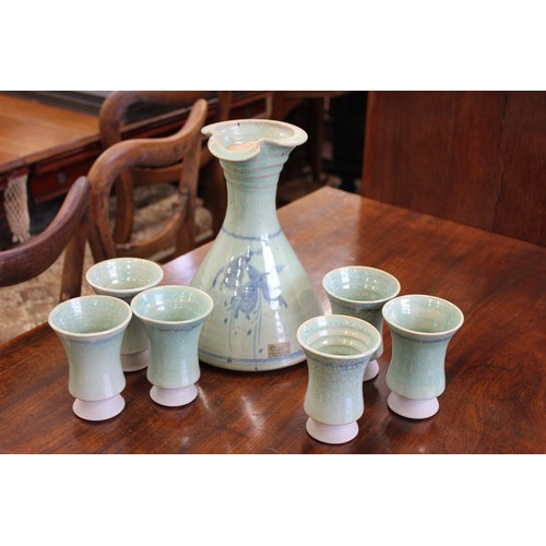 24 - A Louis Mulcahy Irish pottery carafe 26cm high, and six beakers (7).