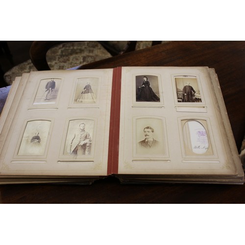 26 - Two Victorian photograph albums containing a number of family pictures, a.f. to spines and covers. (... 