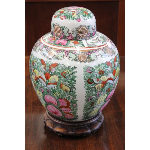 34 - A modern Chinese famille rose spice jar and cover on wooden stand, 33cm high.