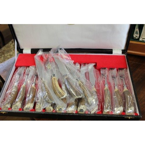 36 - A canteen of silver-plated cutlery in yew & satin beech box & a set of bone handled stake knives & f... 