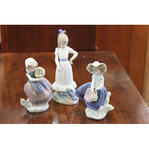 37 - Two Lladro porcelain figures of flower girls each 7cm high & a Nao figure of girl with puppy, 24cm h... 