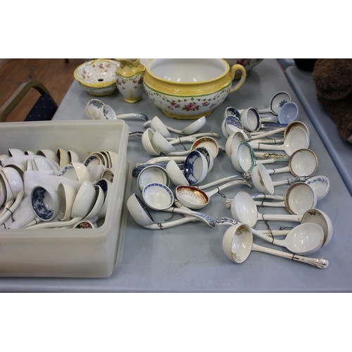 219 - A collection of English Victorian pottery sauce ladles by various manufacturers. (63).