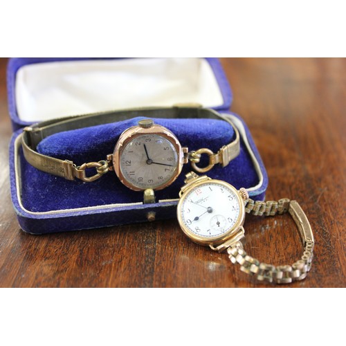 227 - A lady's gold Waltham wristwatch, a further gold wristwatch, both boxed, a.f. (2)