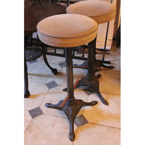 1 - Three reproduction circular top pub tables, each 58cm in diameter, on cast iron bases, and three sto... 