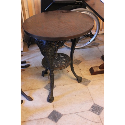 1 - Three reproduction circular top pub tables, each 58cm in diameter, on cast iron bases, and three sto... 