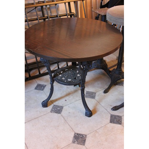 1 - Three reproduction circular top pub tables, each 58cm in diameter, on cast iron bases, and three sto... 