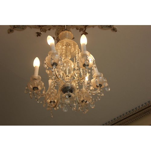 5 - A six-branch glass drop chandelier.