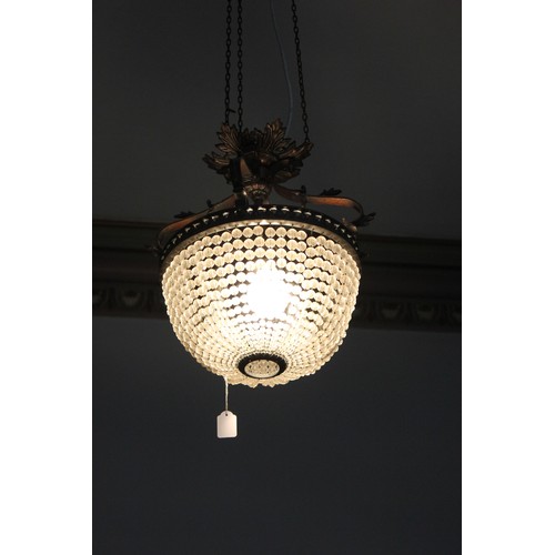 13 - A decorative metal and basket form chandelier, with three internal branches.