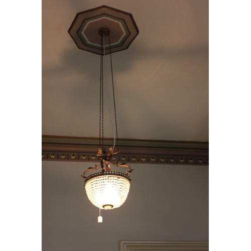 13 - A decorative metal and basket form chandelier, with three internal branches.