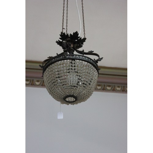 13 - A decorative metal and basket form chandelier, with three internal branches.