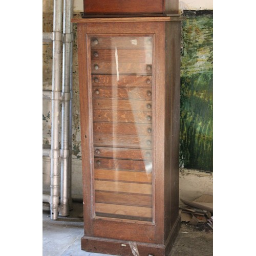 14 - An early 20th century oak collector's cabinet, fitted eighteen drawers, 52cm wide x 130cm high, and ... 