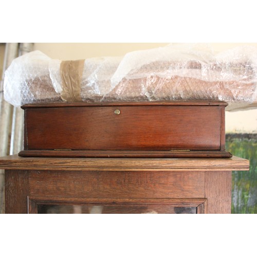 14 - An early 20th century oak collector's cabinet, fitted eighteen drawers, 52cm wide x 130cm high, and ... 