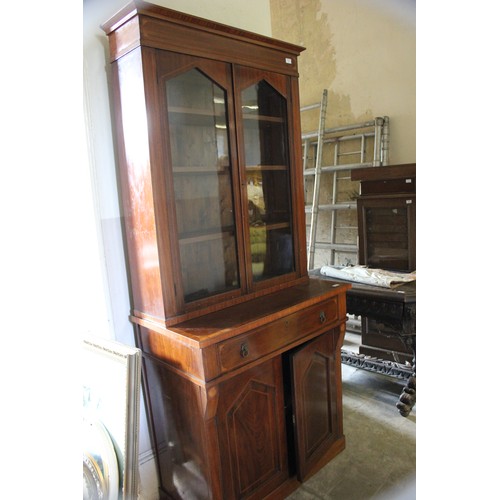 16 - A Regency-style mahogany bookcase cabinet, with lion mask ring handles, satinwood banding, on later ... 