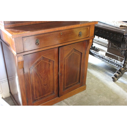 16 - A Regency-style mahogany bookcase cabinet, with lion mask ring handles, satinwood banding, on later ... 