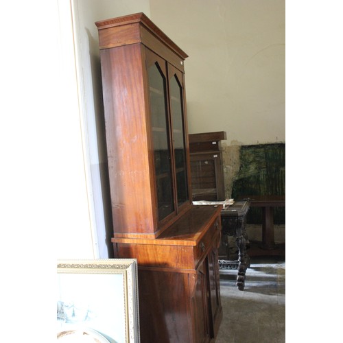 16 - A Regency-style mahogany bookcase cabinet, with lion mask ring handles, satinwood banding, on later ... 