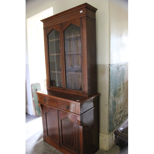 16 - A Regency-style mahogany bookcase cabinet, with lion mask ring handles, satinwood banding, on later ... 