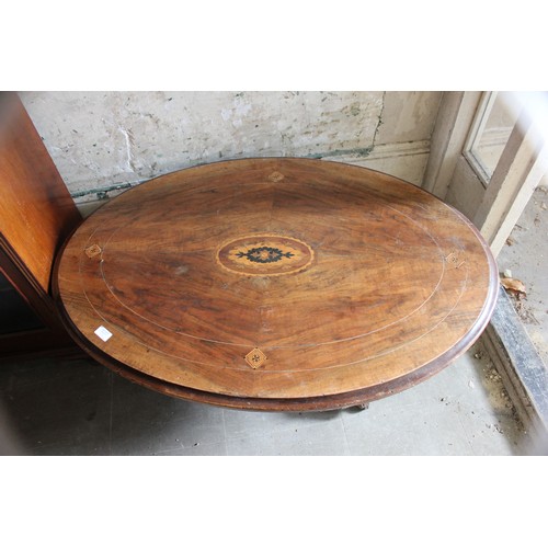 17 - A Victorian low oval occasional table, 75cm x 102cm, a Victorian music cabinet (2).