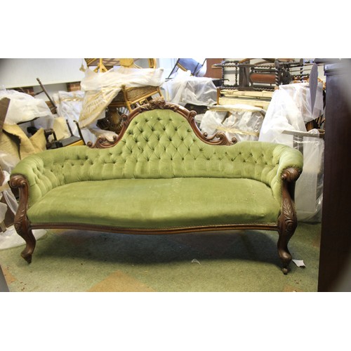 18 - A Victorian button upholstered settee.