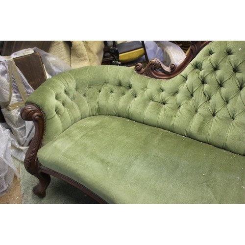 18 - A Victorian button upholstered settee.