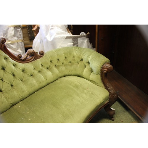 18 - A Victorian button upholstered settee.