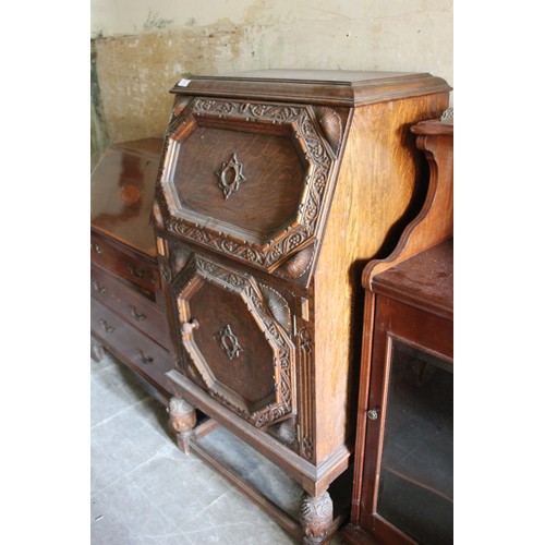 19 - A small early 20th century carved oak bureau, 61cm wide, and an Edwardian inlaid mahogany bureau, 70... 